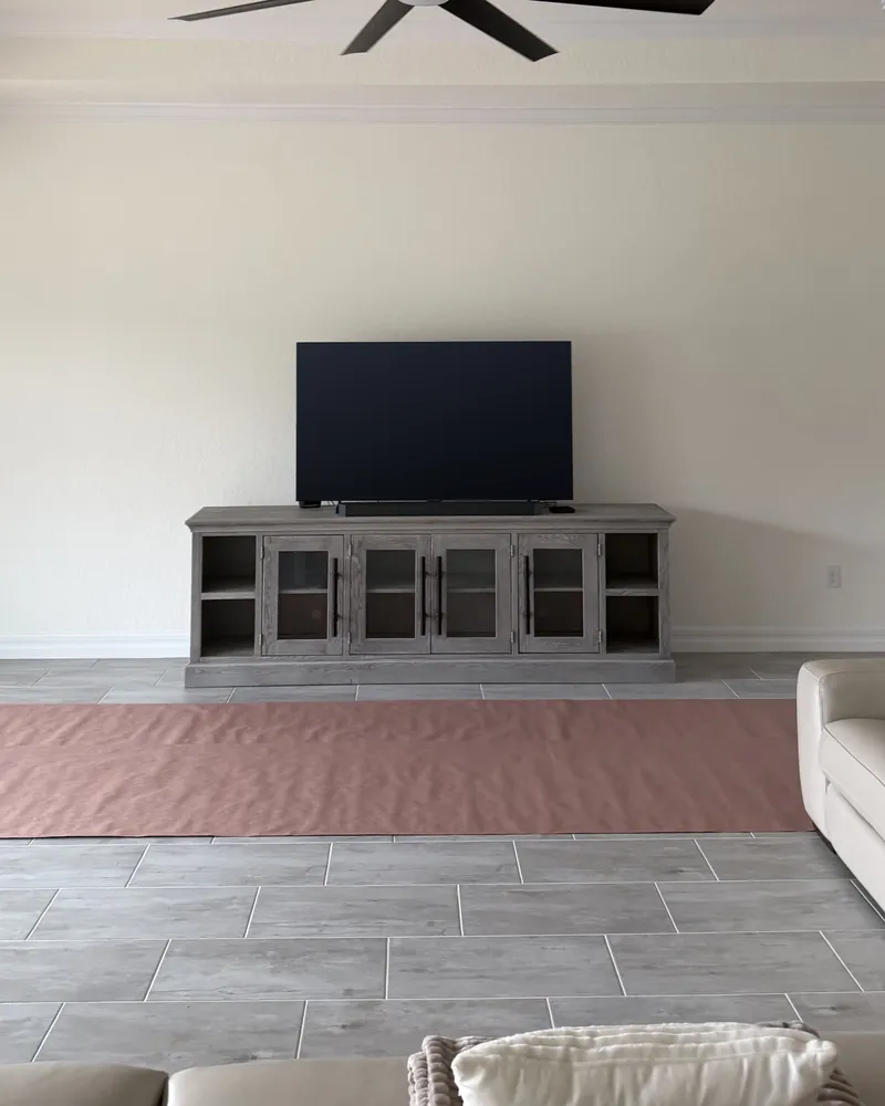 Before: a plain wall with a TV on a console
